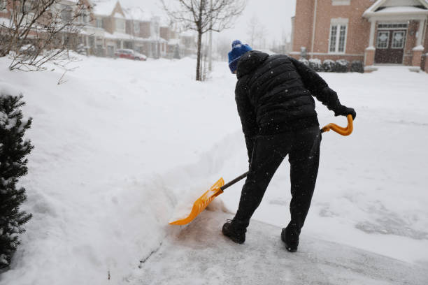istock Man shoveling snow during snow storm in Toronto 1132615913