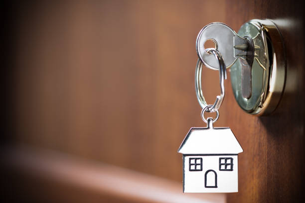 istock House key in the door 1132616017