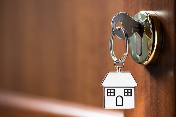 istock House key in the door 1132616105
