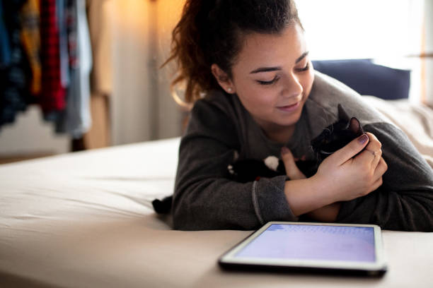 istock Woman in Bed with Cat 1132616948