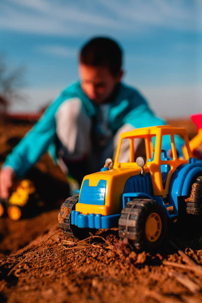istock Cute little boy playing with truck toy 1132617081