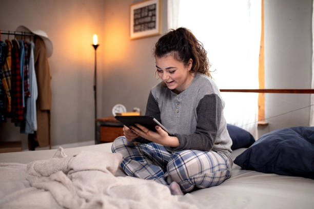 istock Young woman using a tablet in the bedroom 1132617234