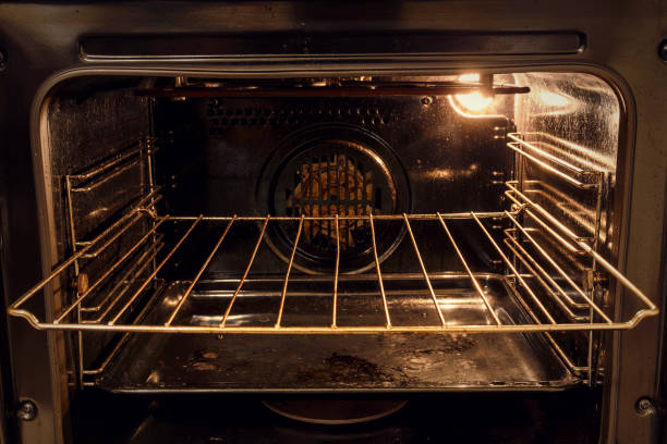 Empty electric oven with grill stainless steel grate for barbecue