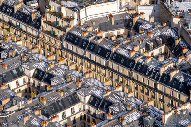 istock Paris buildings with snow on the roofs 1132620278