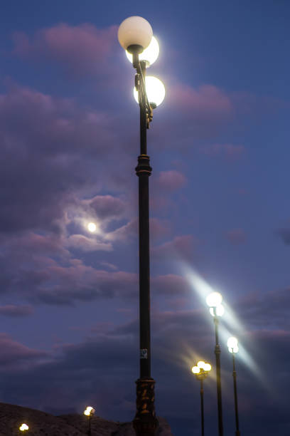istock Electric lamp post against the dark sky 1132620508
