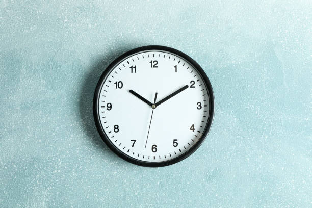 istock Big beautiful clock hanging on color background, space for text 1132620664