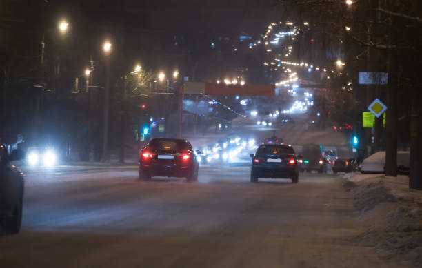 istock car traffic on a night winter street 1132620695