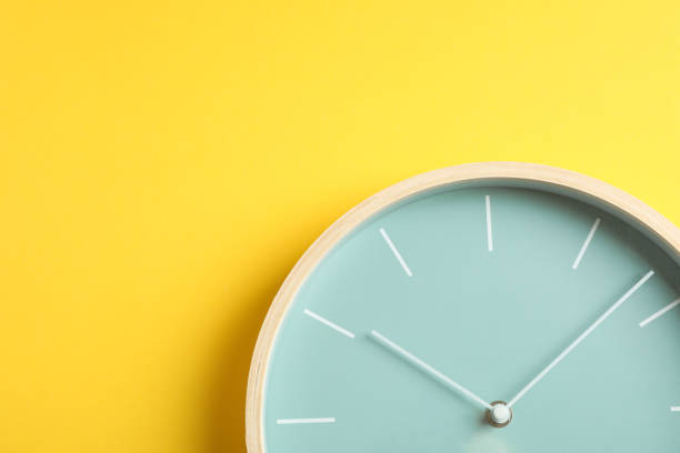 istock Big beautiful stylish clock on yellow background, space for text 1132620896