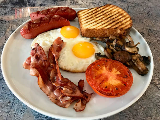 istock Aussie / Australian Breakfast with Brioche Toast, Fried Eggs, Crispy Bacon Sausage and Mushrooms. 1132620941
