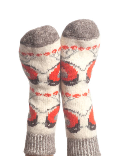 istock Wool socks on woman's feet isolated on white background 1132622787