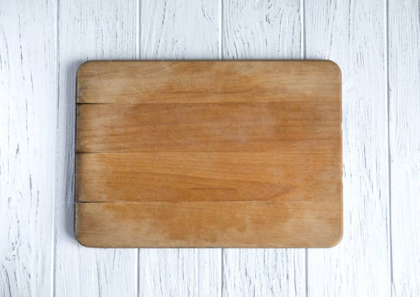 istock Space for text in the form of an old kitchen board on a white wooden background. Frame for text. Kitchen frame for text. View from above 1132624495