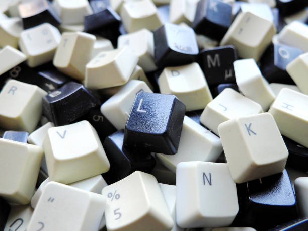 Black and white computer keyboard keys close-up. Concept of unstructured big data that need to be sorted ready to be consumed by machine learning model for deep learning. stock photo