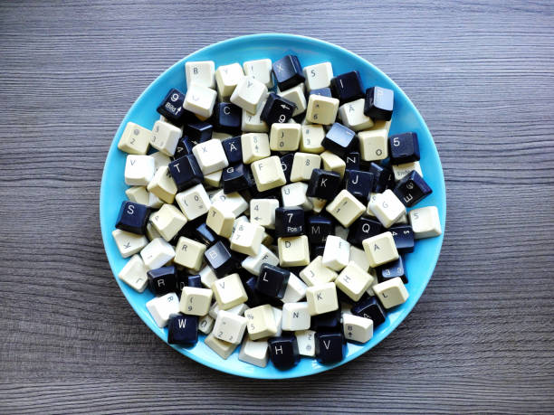 Black and white computer keyboard keys on the plate. Concept of unstructured big data that need to be sorted ready to be consumed by machine learning model for deep learning.