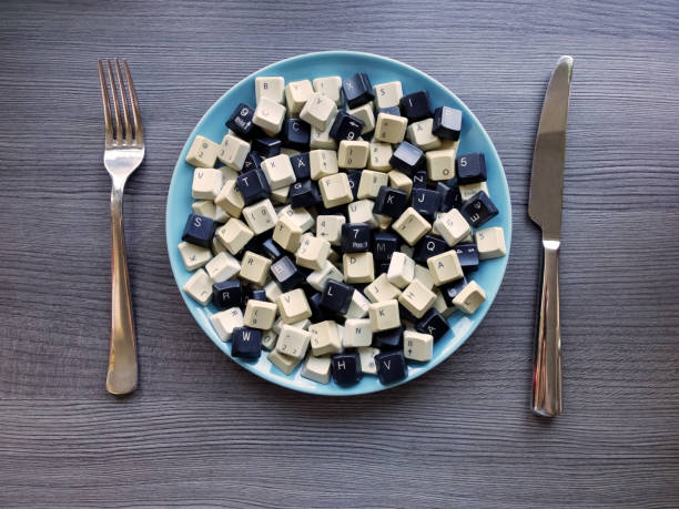 istock Black and white computer keyboard keys on the plate. Concept of unstructured big data that need to be sorted ready to be consumed by machine learning model. 1132626735