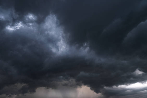 Scary epic sky with menacing clouds. Hurricane wind with a thunderstorm. Stock background, photo stock photo