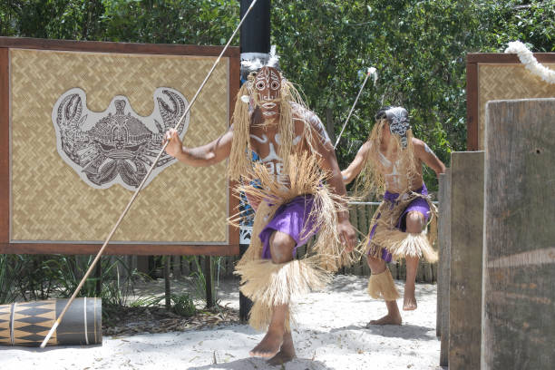 Queensland, Australia - January 11 2019:Torres Strait Islander men dancing traditional Aboriginal dance during a show for visitors in Queensland, Australia. The Torres Strait islands located between the tip of Cape York in Queensland Australia and Papua New Guinea.