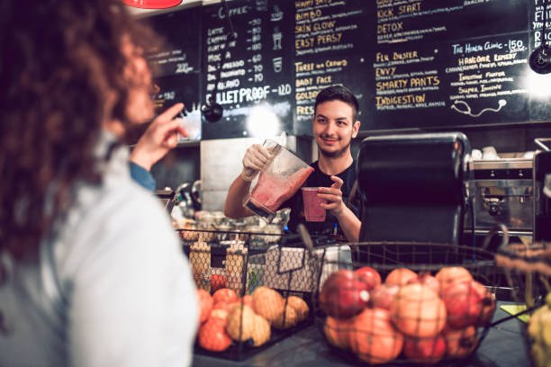 istock Girl Choosing a Smoothie At The Bar 1132635229