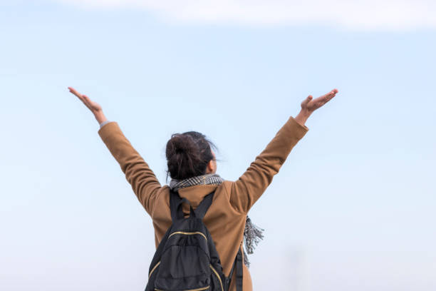 istock Woman with blue sky 1132636360