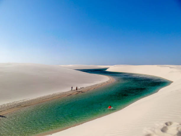 Maranhão-Maranhão-Brazil Sheets Lençois Maranhenses - Maranhão - Brazil. Crystalline water accumulated from the rain in a desert with white and fine sands. Sunny and hot day, blue sky. brazil desert maranhao state national park stock pictures, royalty-free photos & images