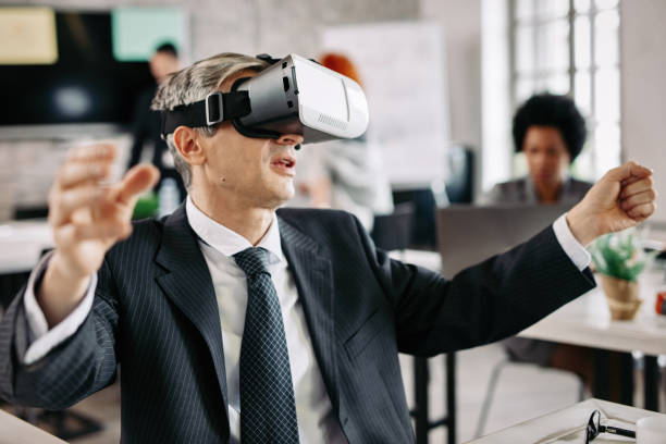 istock Businessman using virtual reality goggles in the office. 1132642938