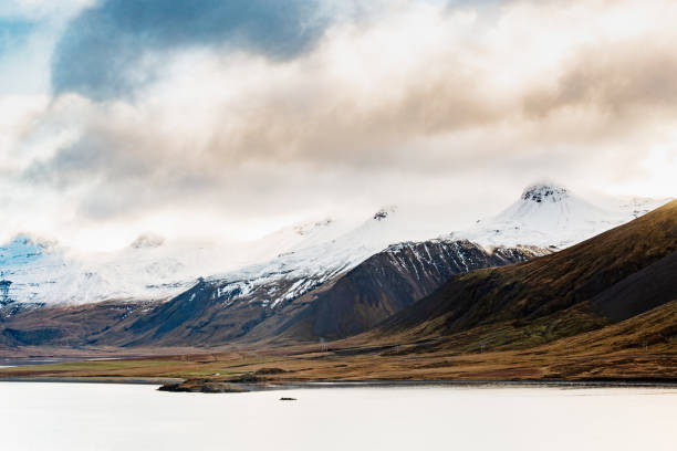 This is a color photograph of a mountain and water landscape in the Snaefellsnes landscape in Iceland.
