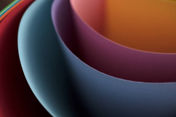 istock Abstract colored papers on blue, pink and orange background. 1132644650