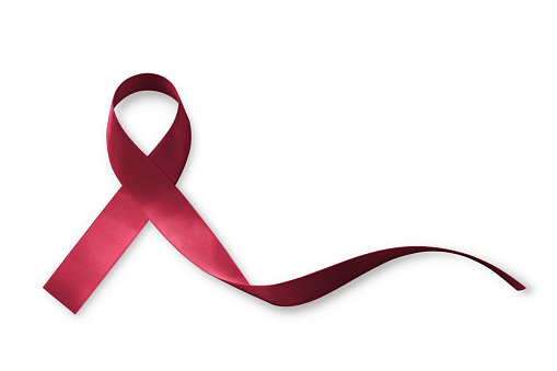 Burgundy ribbon for multiple myeloma cancer and Sickle-Cell Anemia awareness isolated on white background (clipping path)