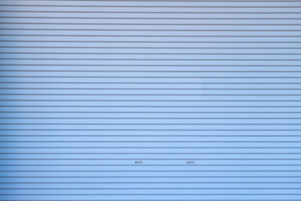 istock Metal roller shutter door or gate wall closed background. 1132645043