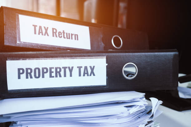 istock HR-human resources business bookkeeping accountancy Document Reports Concept. Tax return and property tax folders stack with label on black binder on paperwork documents summary report in busy offices 1132646951