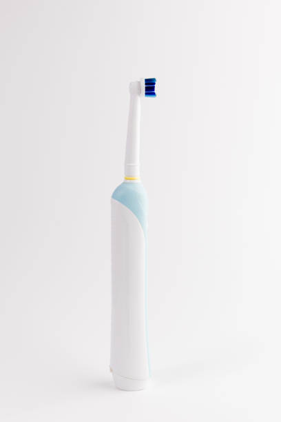 Electric toothbrush stands isolated on white stock photo