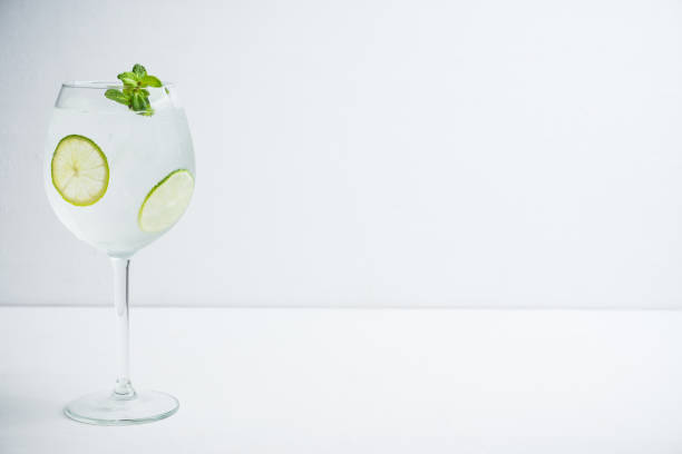 istock Martini royale cocktail in wine glass with lime and mint 1132647776