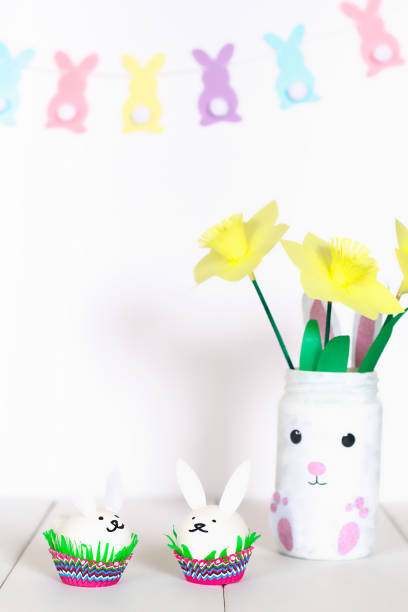 istock Diy Easter garland bunnies, flags EASTER made paper white wall background. Gift idea, decor Easter 1132649259