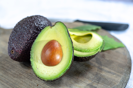 Two fresh ripe raw hass avocados, close up, healthy food concept