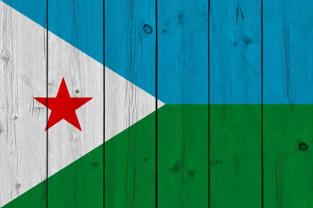 Photo of Djibouti flag painted on old wood plank