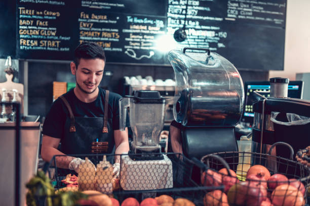 istock Male Barista At Smoothie Bar 1132651013