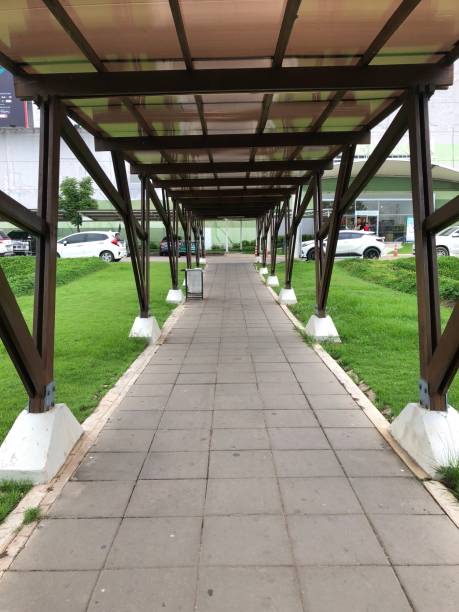 istock Walk path  with sun roof  through  the shopping  mall 1132654204