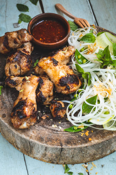 Grilled chicken with lemongrass and noodle and pea salad Grilled Chicken with Lemongrass and Noodle Salad and Peas grillade stock pictures, royalty-free photos & images