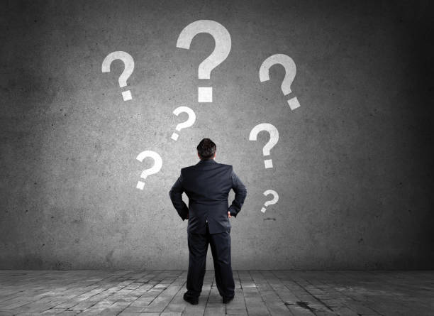 istock Businessman thinking looking mark questions 1132659070