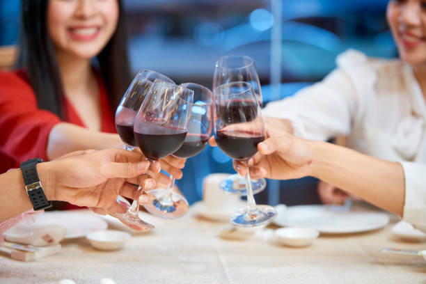 istock People toasting with wine glasses 1132664349