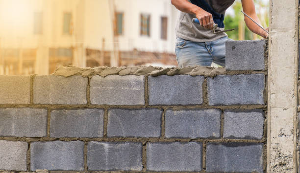 istock Construction workers are working on building a wall for the village. 1132672561