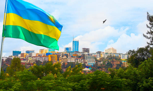 Kigali skyline of Business district with flag, Rwanda View of Kigali business district with offices, towers and residential homes, and Rwanda's flag. rwanda stock pictures, royalty-free photos & images