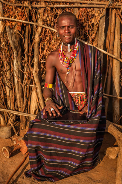 istock Young man from Erbore tribe using a digital tablet, Ethiopia, Africa 1132675267