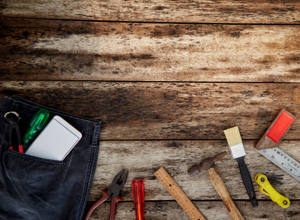 istock Set of working tools on wooden background 1132675541