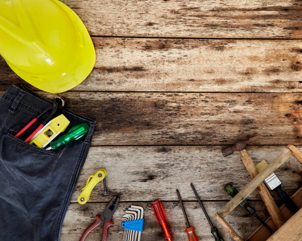 istock Set of working tools on wooden background 1132676097
