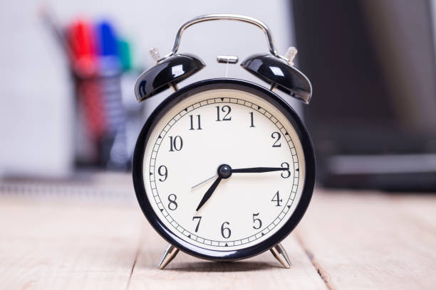 istock Black Alarm clock on table Business background,concept time to work 1132676382