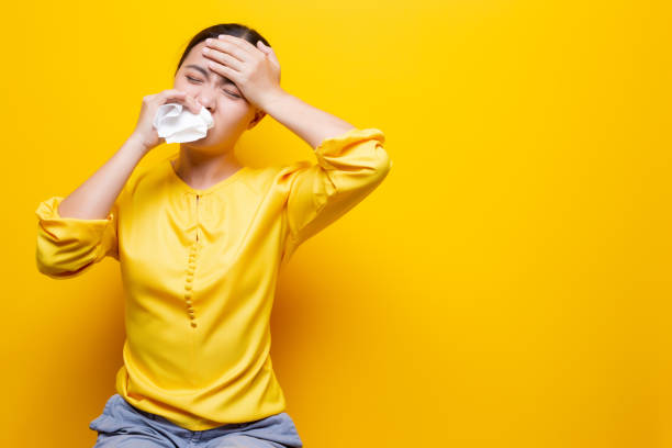 istock Woman use tissue paper after she sneezing 1132676454