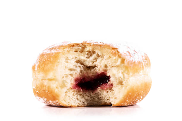 istock Bitten off Berliner or donut, isolated against white background 1132677424