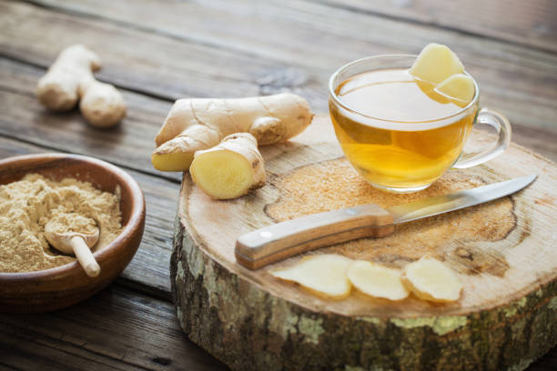 istock ginger tea on old wooden background 1132680249