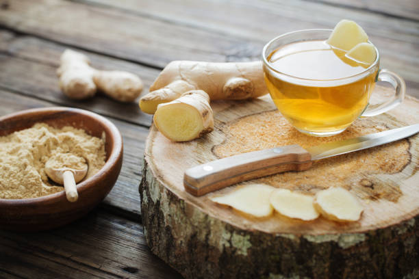 ginger tea on old wooden background stock photo