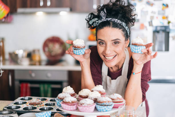 istock Confectioner having fun in the kitchen with chocolate muffins 1132680704